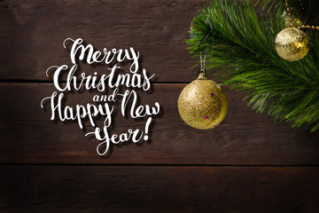  branch of spruce and two golden balls. The inscription is added Merry Christmas and Happy New Year