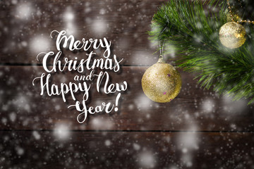  branch of spruce and two golden balls, snowfall. The inscription is added Merry Christmas and...