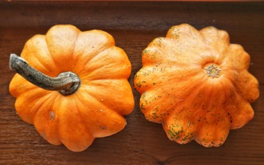 small pumpkins on the windowsill