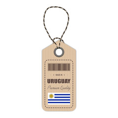 Hang Tag Made In Uruguay With Flag Icon Isolated On A White Background. Vector Illustration. Made In Badge. Business Concept. Buy products made in Uruguay. Use For Brochures, Printed Materials, Logos