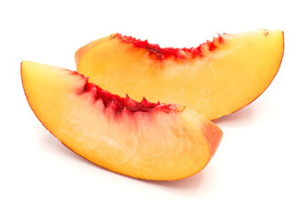 Two peach slices isolated on white background.