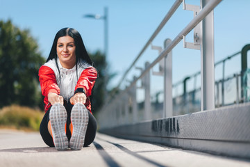 City workout. Beautiful woman training in an urban setting