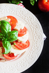 Caprese salad with mozzarella, tomato, basil