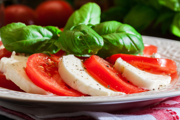 Caprese salad with mozzarella, tomato, basil