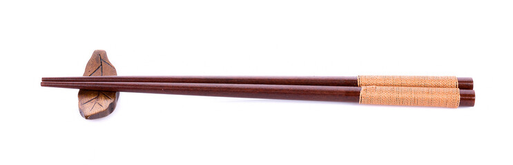 Wooden pairs of chopsticks on white background