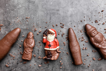 Delicious Christmas chocolate and sweets on rustic background