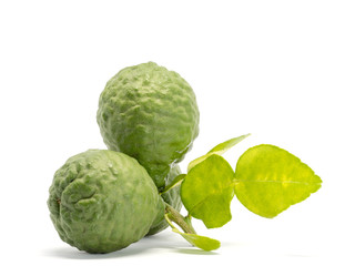 close up group of fresh bergamot with green leaves isolated on white background. benefits of bergamot for beauty and health concept