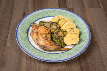 Czech food, traditional roasted rabbit with spinach and potato dumplings