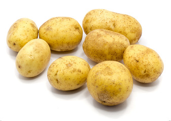 Group of several whole potatoes isolated on white background.