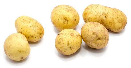 Group of several whole potatoes isolated on white background.