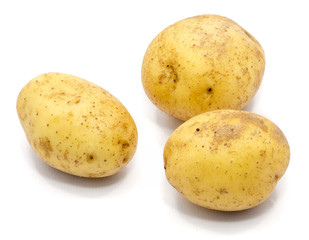 Three whole potatoes isolated on white background.