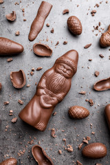 Delicious Christmas chocolate and sweets on rustic background