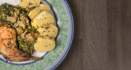 Czech food, traditional roasted rabbit with spinach and potato dumplings