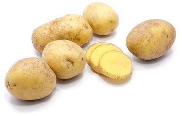 Group of whole potatoes with slices isolated on white background.