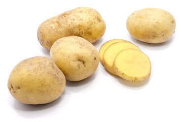 Group of whole potatoes with slices isolated on white background.