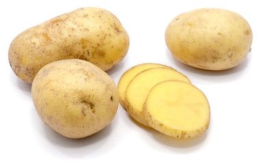 Three whole potatoes with slices isolated on white background.