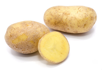 Two whole potatoes and a half isolated on white background.