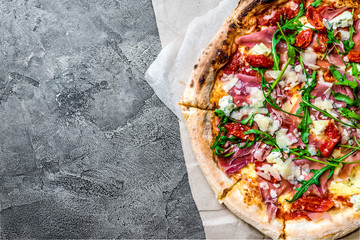 Pizza with a jamon and rucola