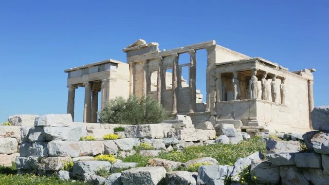 Erechtheum temple ruins on the Acropolis in a summer day in Athens, Greece