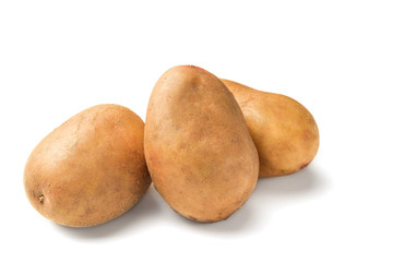 Uncooked, unpeeled, fresh whole potatoes isolated on white background