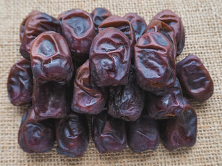 Delicious fresh organic dates over bright background
