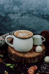 Cup of hot cocoa with chocolate on rustic background. Christmas chocolate drink. Christmas concept.