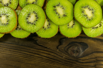 Sliced kiwi fruits on wooden table