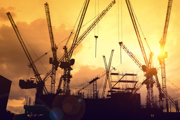 concept image of Silhouette the building under construction with crane