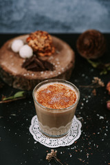 Hot cappuccino on rustic background