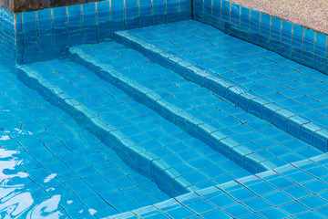 Obraz premium Swimming pool with a stone flooring beside it