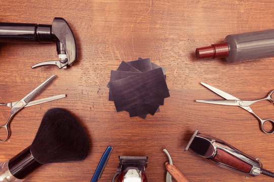 Top view of vintage barbershop tools on wooden background, flat lay overhead view