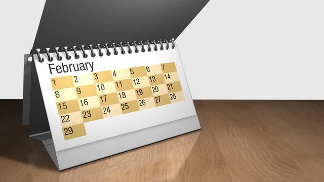 3D animation of a desk calendar on a wooden table with white background. Each sheet contains a month and they are rotating one on top of the other. The calendar contains the date February 29