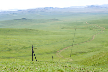 electric line in green steppe - 180608717