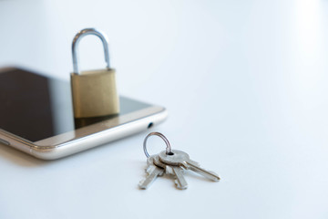 Naklejka premium Telephone with lock, concept of protection of personal information. mobile phone security. chained smartphone. Security of smartphone. Low key lock, internet security smartphone data theft concept