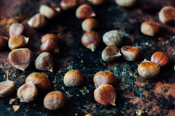 Lot of chestnuts over black rustic surface