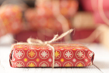 Handmade christmas or New Year gifts on wooden background