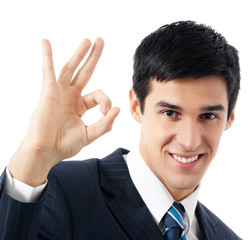 Businessman with okay gesture, isolated