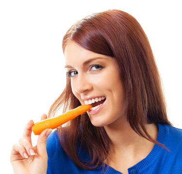 Cheerful woman eating carrots, over white