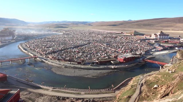 View of the Yarchen Gar Monastery with many shacks for monks in Garze Tibetan, Sichuan, China.