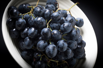 Dark grape in bowl.