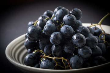 Dark grape in bowl.