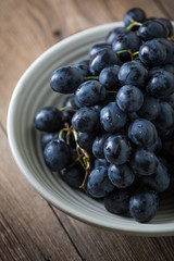 Dark grape in bowl.