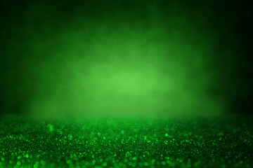 Green glitter vintage lights background. de-focused.