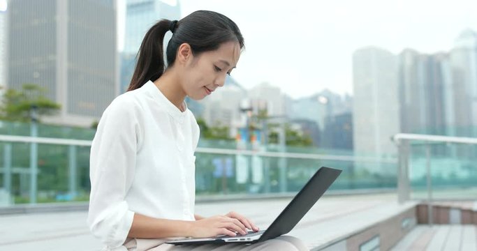 Woman use of laptop computer at outdoor