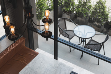 High angle chandelier light interior with table and chair