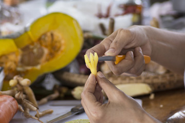 Close up hands when slice finger root Ingredients for Thai Cuisine