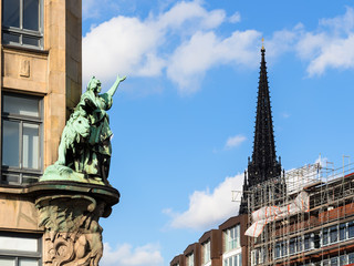 outdoor sculpture and steeple Church in Hamburg