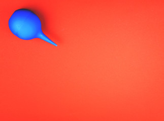 Blue enema on a colored background