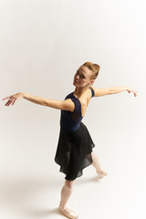 ballerina in a beautiful pa on top of a light background