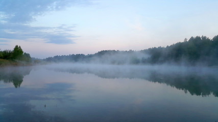 Fototapeta na wymiar Fog over the lake